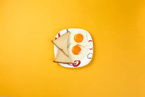 Healthy poached egg breakfast with toasts