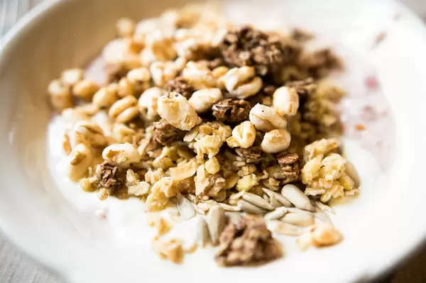Healthy yogurt plate with müsli and seeds
