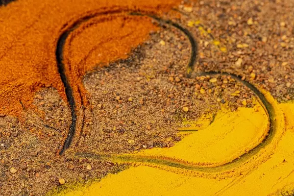 Heart drawn on sprinkled seasonings, close-up