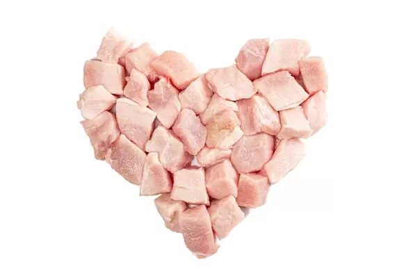 Heart of raw meat slices on white background