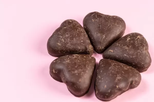 Heart shaped Chocolate on the pink background