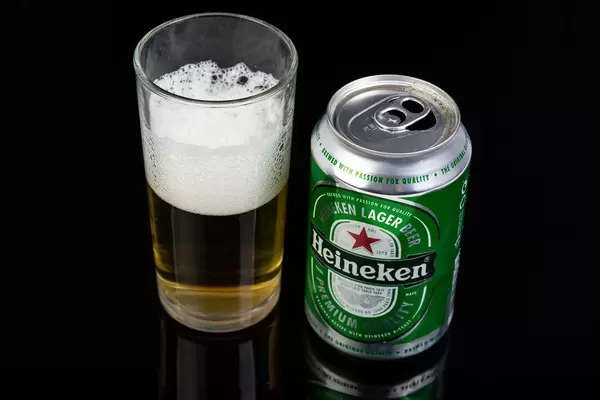 Heineken Canned Beer with beer in the glass