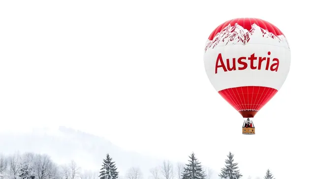 Heißluftballon in winterlicher Landschaft in Österreich