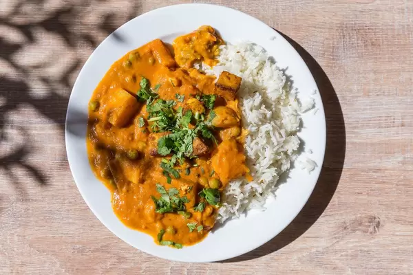 High angle view of Tikki Masala Chicken with rice on plate