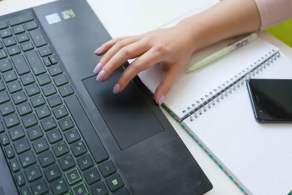 High Angle View of Woman's Hand on the Laptop at the Office