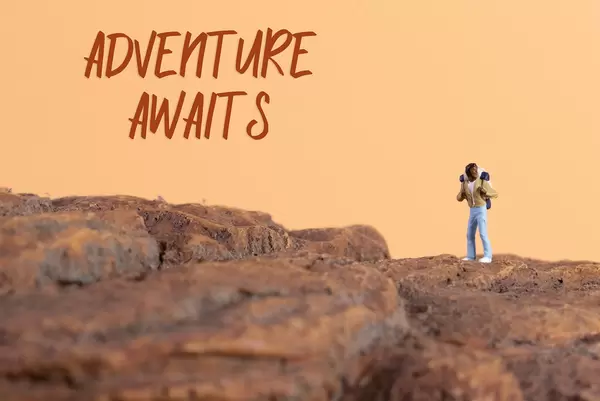 Hiker and Adventure awaits text