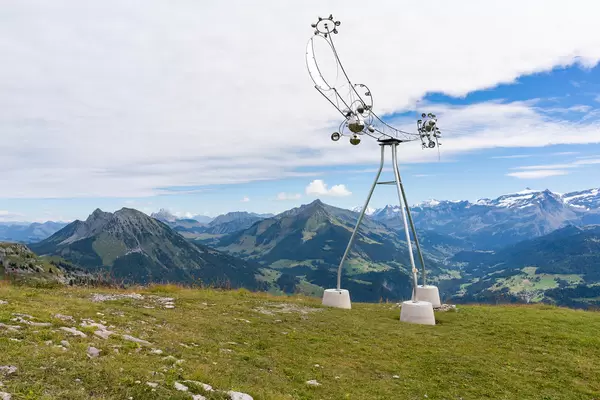 Hill station with a beautiful art-like chrome weather station in Swiss alps