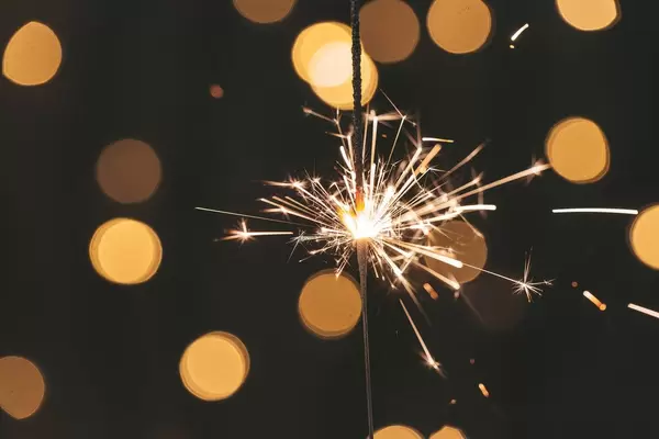 Holiday background with a sparkler (Flip 2019)