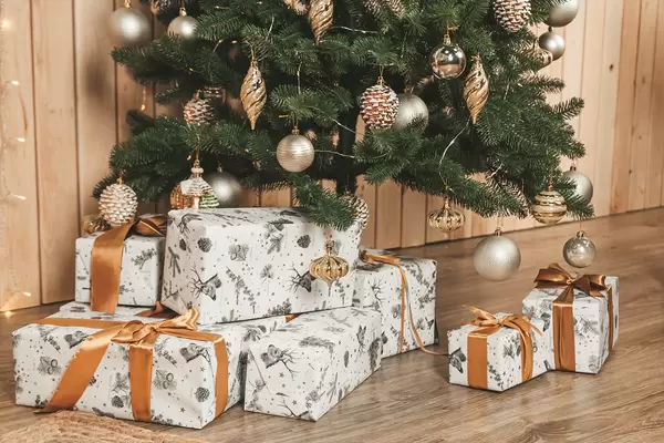Holiday background with gifts and christmas tree