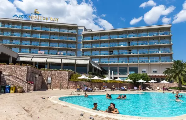 Holiday Guests in the Pool of the Aks Hinitsa Bay beach hotel in the Peloponnes, Greece