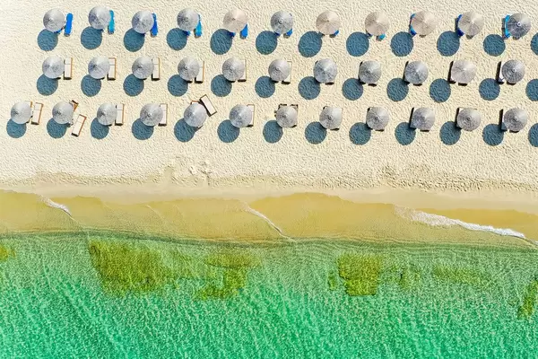 Holiday in summer 2020 on an empty beach in Greece. Drone shot of Plaka, Naxos, south Aegean