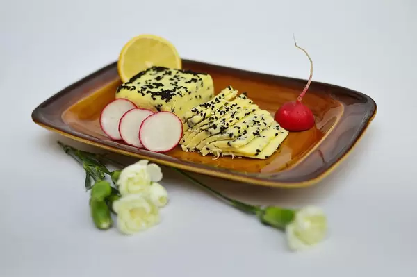 Home cheese with blackcurrant seeds