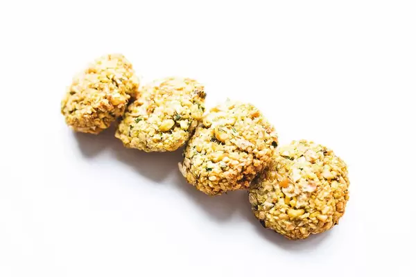 Homemade baked falafels on white background