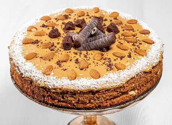 Homemade cake with condensed milk, chocolate, coconut and almonds (Flip 2019)