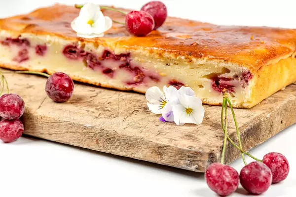 Homemade cherry pie on a wooden kitchen Board