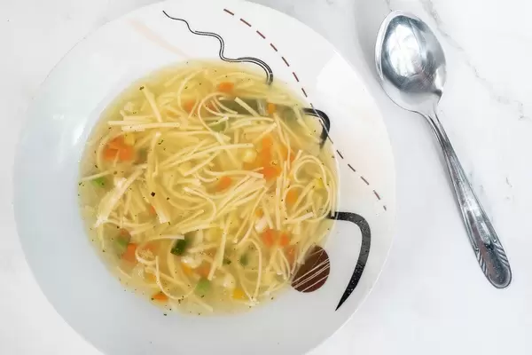 Homemade Chicken Soup with Vegetables on the table (Flip 2019)