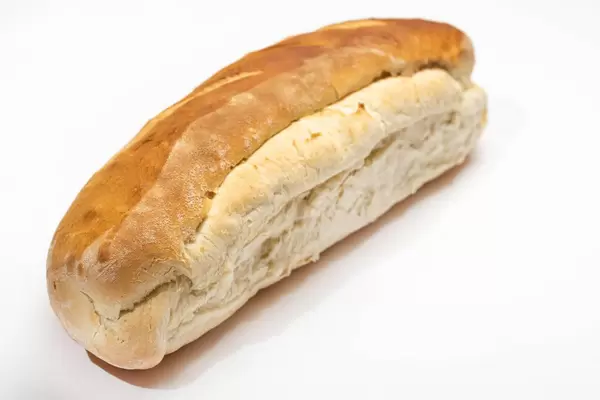 Homemade domestic bread isolated above white background