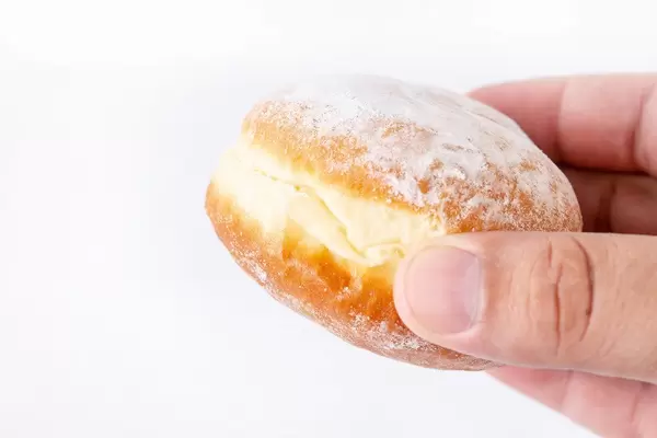 Homemade Donuts with powdered sugar in the hand (Flip 2019)