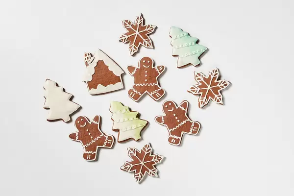 Homemade funny X-mas cookies on white
