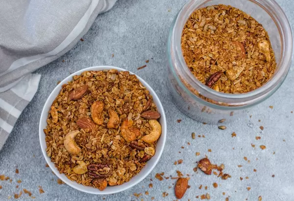 Homemade Granola with a white bowl Top View