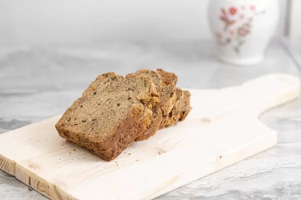 Homemade healthy bread sliced on the wooden board