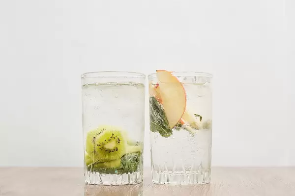 Homemade iced lemonade with mint and summer fruits