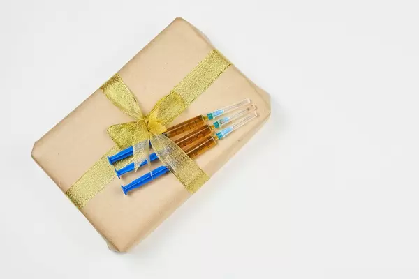 Homemade New year present with attached several doses of New coronavirus vaccine