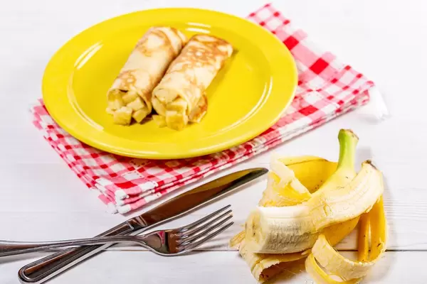 Homemade pancakes with fresh banana (Flip 2019)