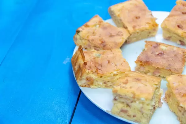 Homemade Pie with Cheese and Ham served on the plate