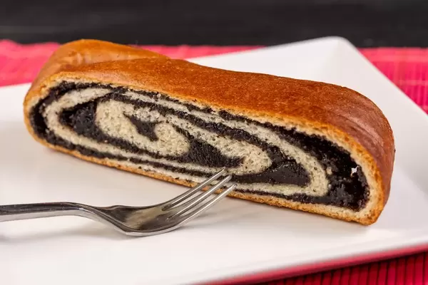 Homemade Roll with Poppy seed on the plate (Flip 2019)