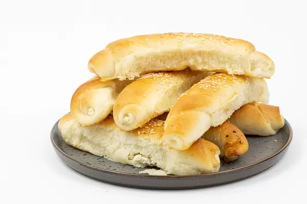 Homemade Rolls served on the plate above white background
