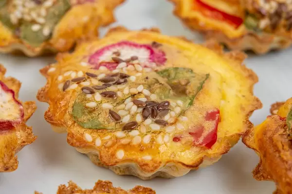 Homemade tasty appetizers with paprika radishes and spinach