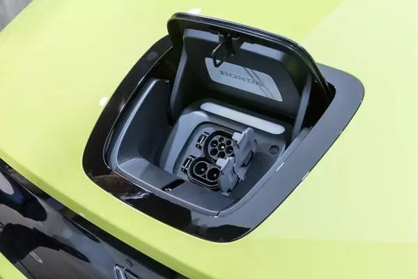 Hood of e-car: European fast charging connection for CCS 2-system of Honda-e electric vehicle