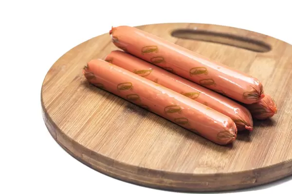 Hot dog Frankfurters isolated on the wooden board