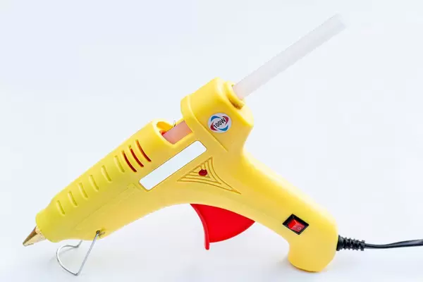 Hot glue gun on white background