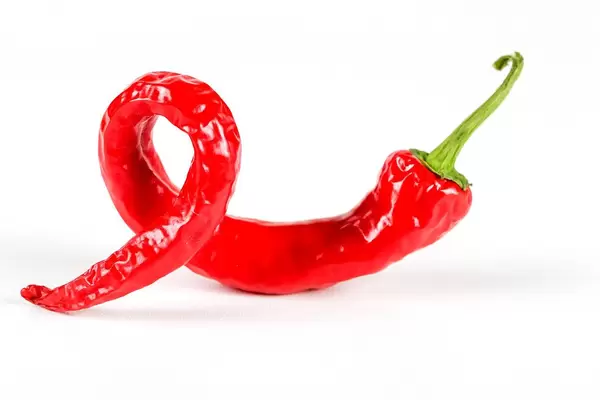 Hot red chili pepper on white background