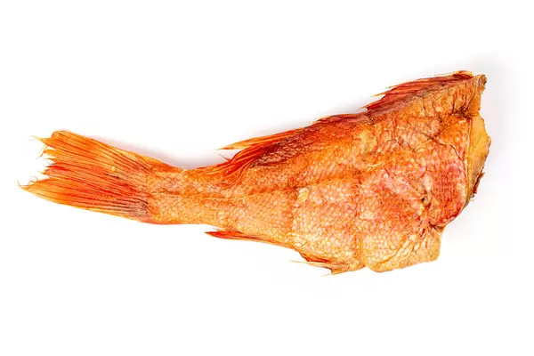 Hot smoked bass fish on white background
