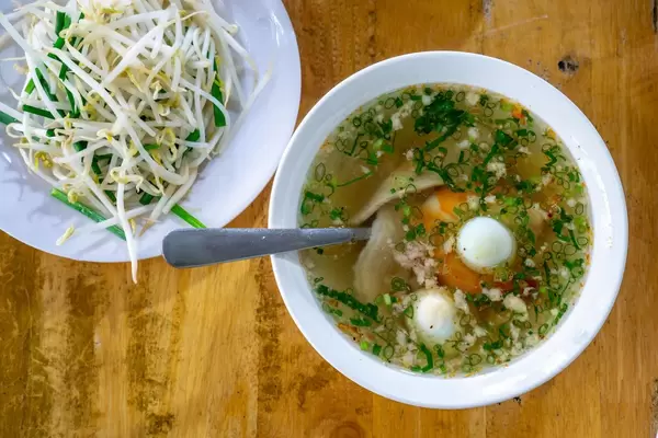 Hu Tieu Broth with Pork, Quail Egg and Beansprouts in Vietnam