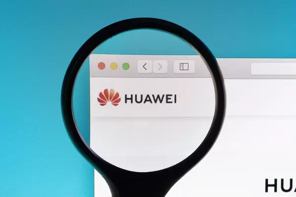 Huawei logo under magnifying glass