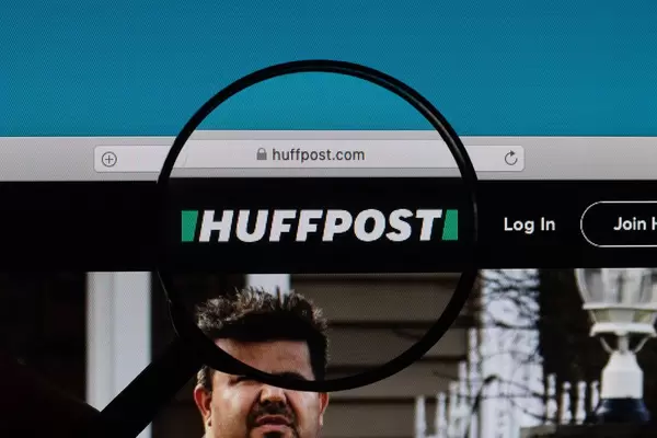 Huffpost logo under magnifying glass
