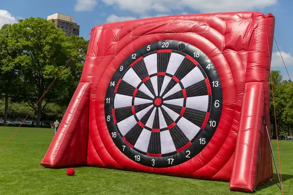 Huge, inflatable dartboard in the club colours of the 1. FC Cologne, for the national soccer league finals at a Park near RheinEnergie football stadium