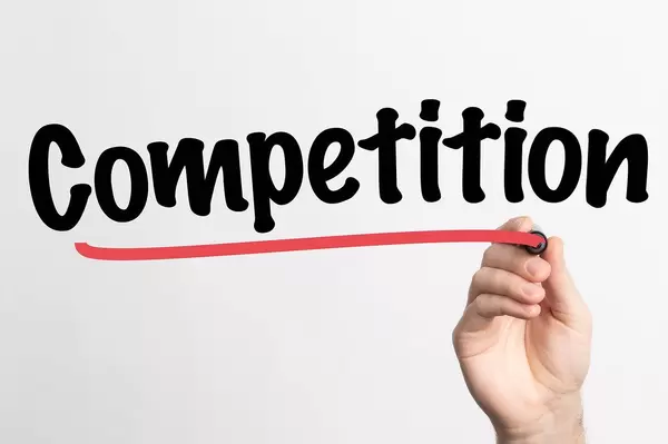 Human hand writing Competition on whiteboard