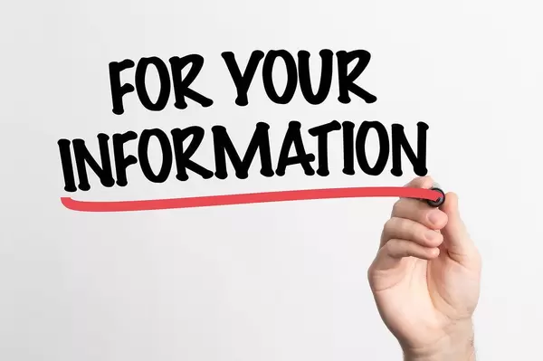 Human hand writing For Your Information on whiteboard