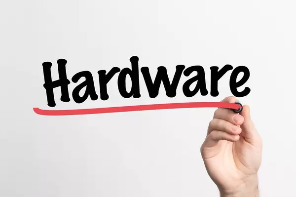 Human hand writing Hardware on whiteboard