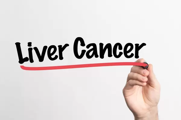 Human hand writing Liver Cancer on whiteboard