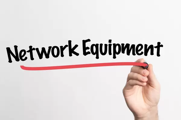 Human hand writing Network Equipment on whiteboard