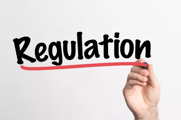 Human hand writing Regulation on whiteboard