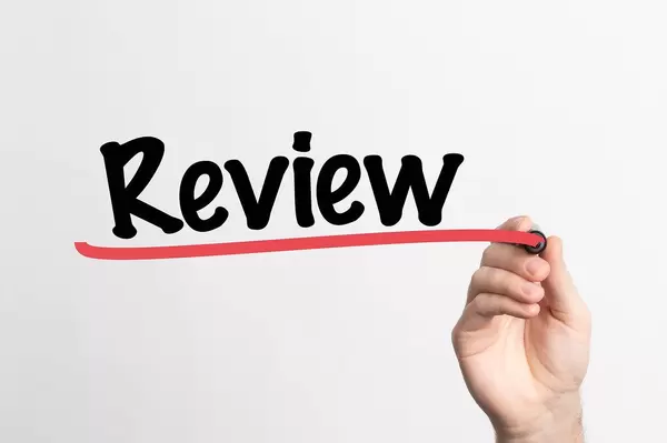 Human hand writing Review on whiteboard