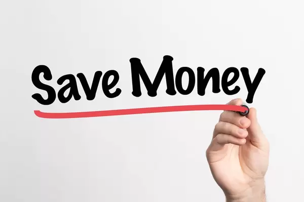 Human hand writing Save Money on whiteboard