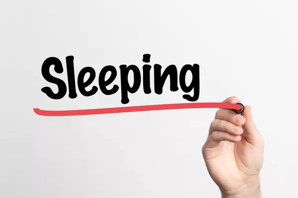 Human hand writing Sleeping on whiteboard